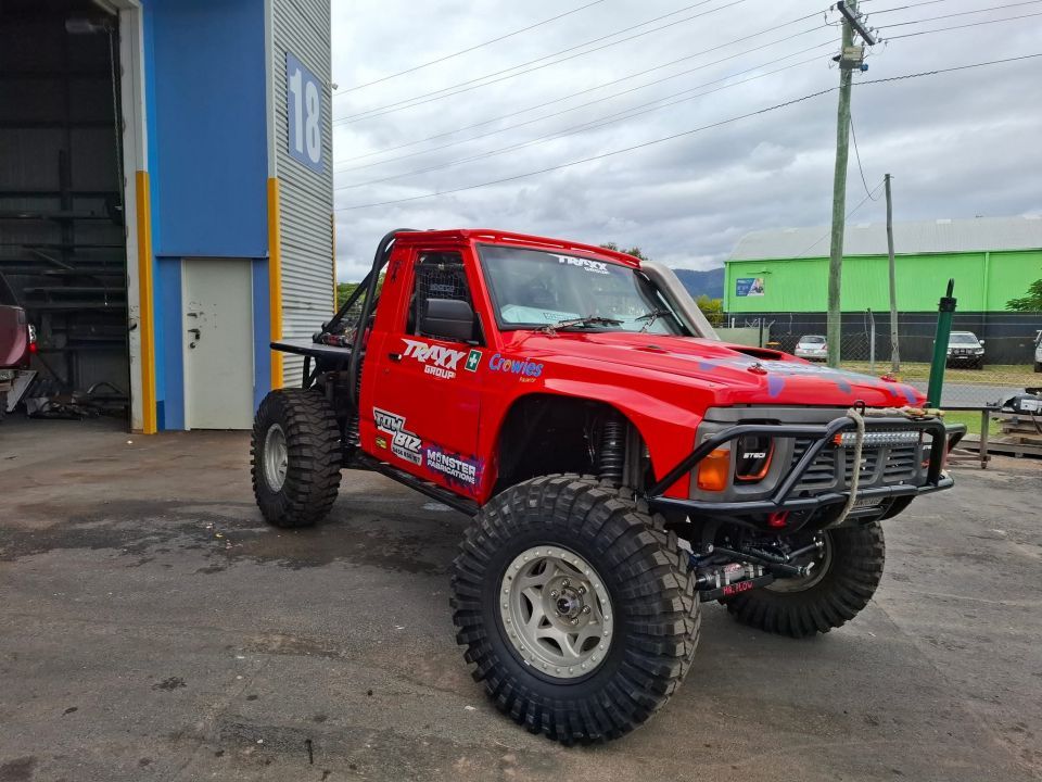 A Red Truck is Parked in Front of a Building — Tow Biz in Park Avenue, QLD