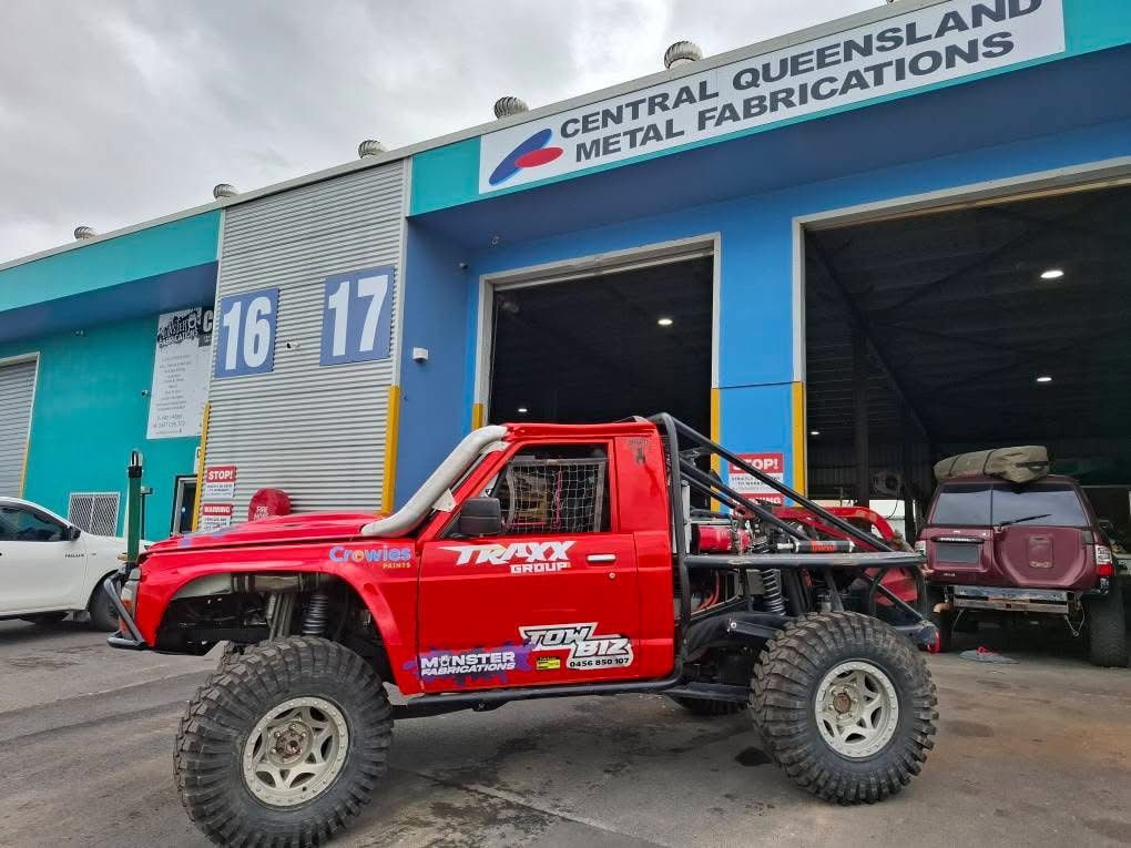 A Red Truck is Parked in Front of a Building — Tow Biz in Park Avenue, QLD