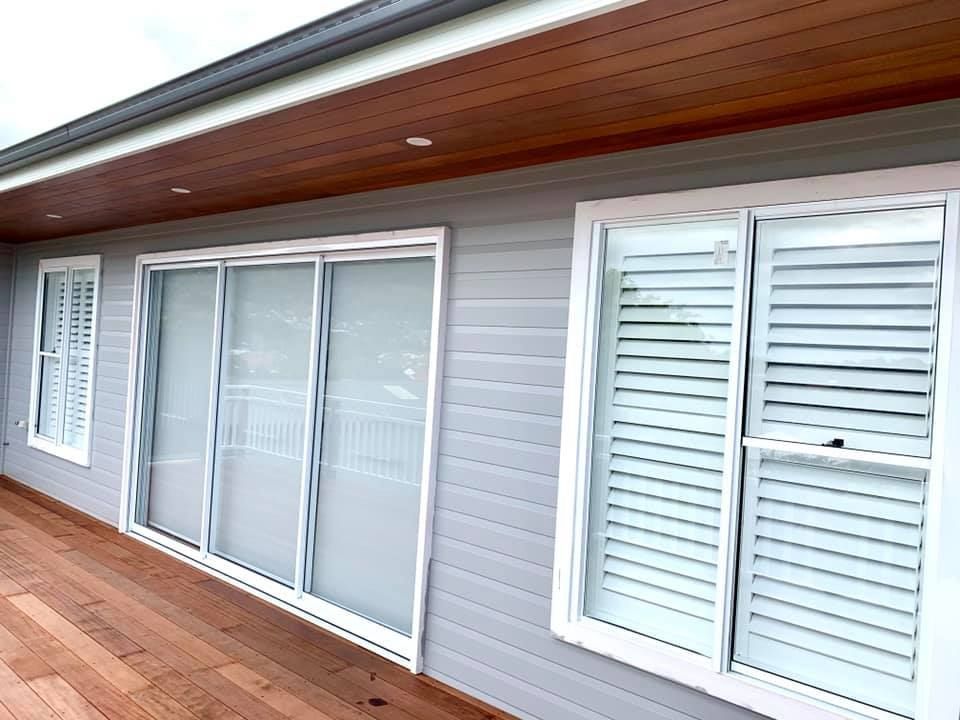 Exterior View of a House With a White-framed Windows — Glenn Koek - Shutters - Curtains - Blinds in West Wollongong, NSW