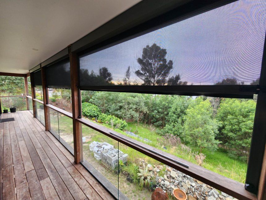 Covered Porch With Lowered Black Mesh Blinds — Glenn Koek - Shutters - Curtains - Blinds in Shellharbour, NSW
