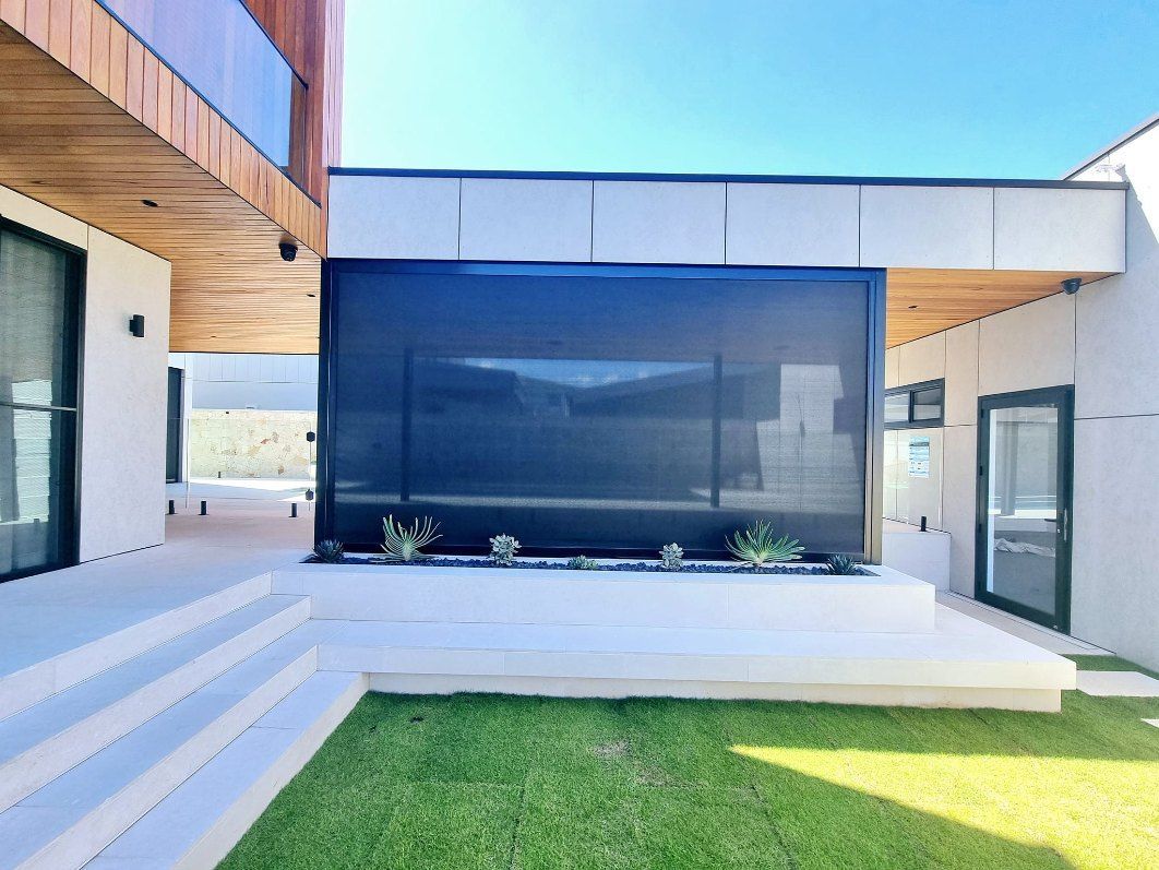 Outdoor Patio With Retractable Black Shade — Glenn Koek - Shutters - Curtains - Blinds in Sutherland Shire, NSW