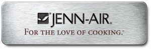 A silver jenn-air for the love of cooking logo on a white background.