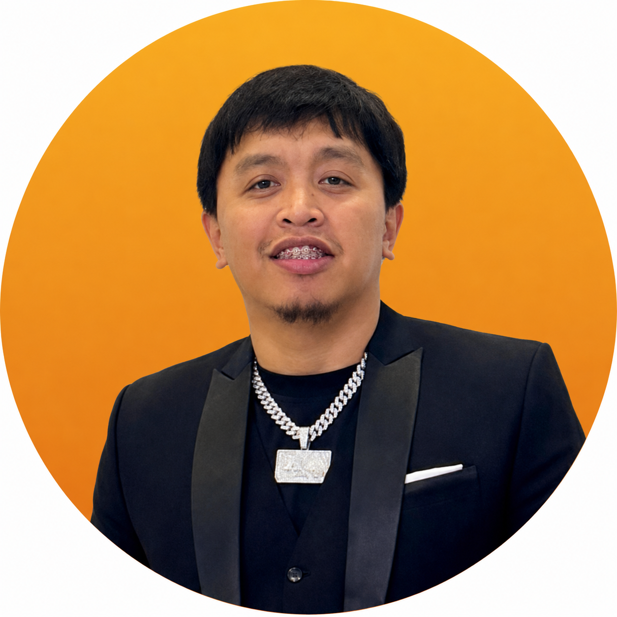 A man in a suit and tie is smiling in a yellow circle.
