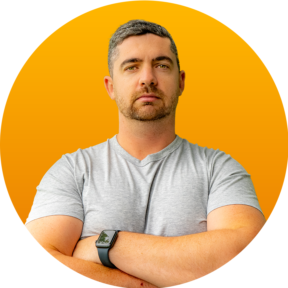A man with his arms crossed is wearing a watch.