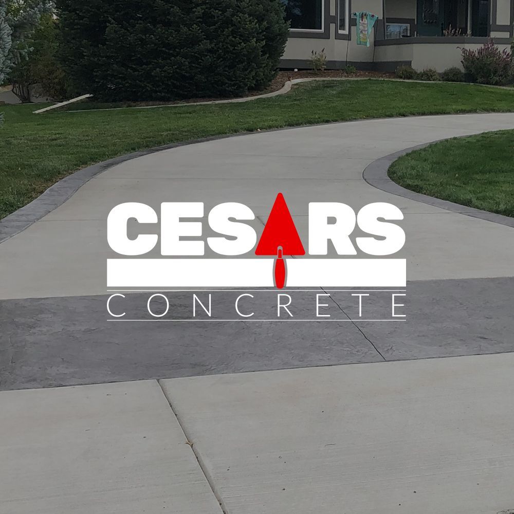 A concrete driveway with the words cesars concrete on it