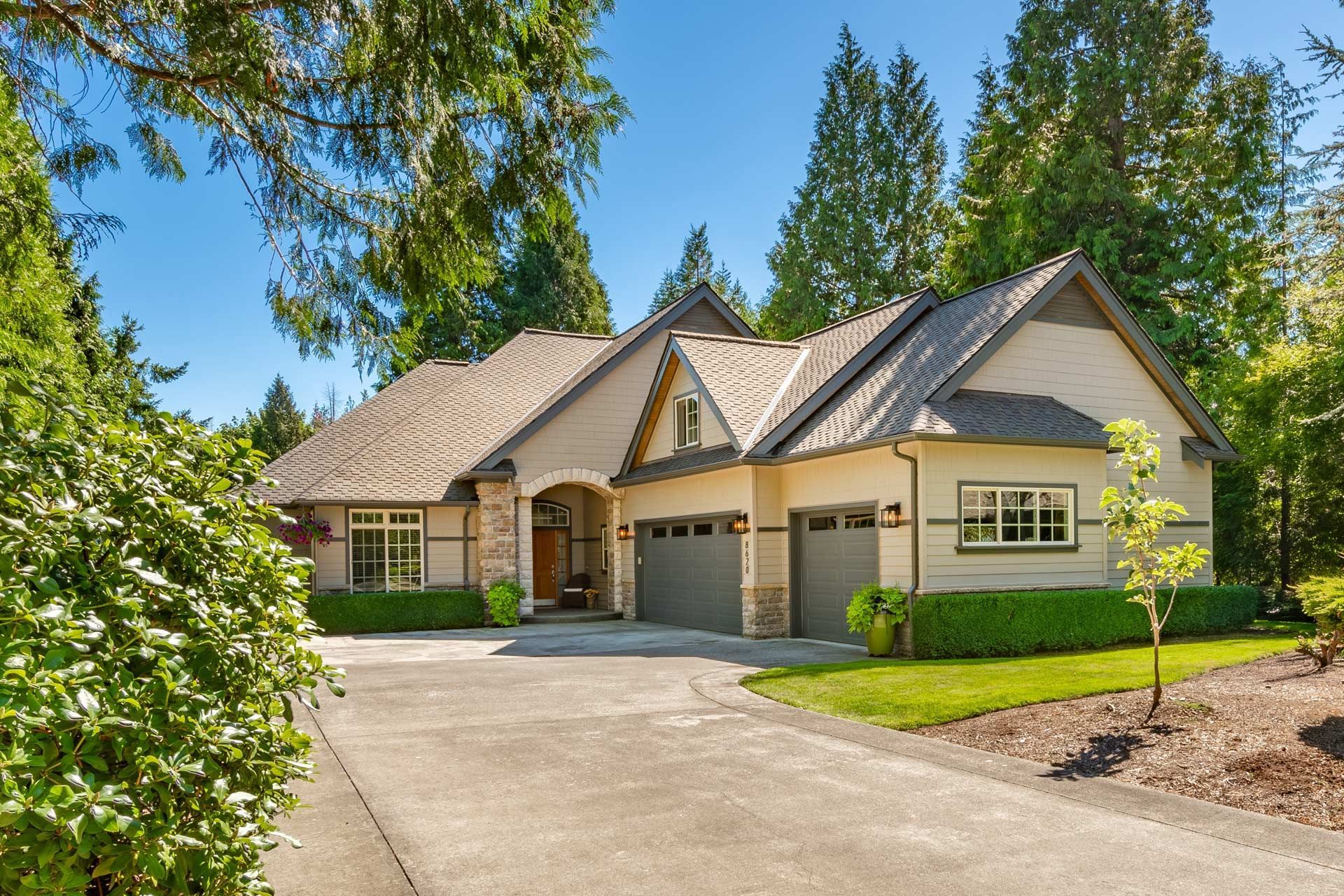 A large house with a driveway leading to it