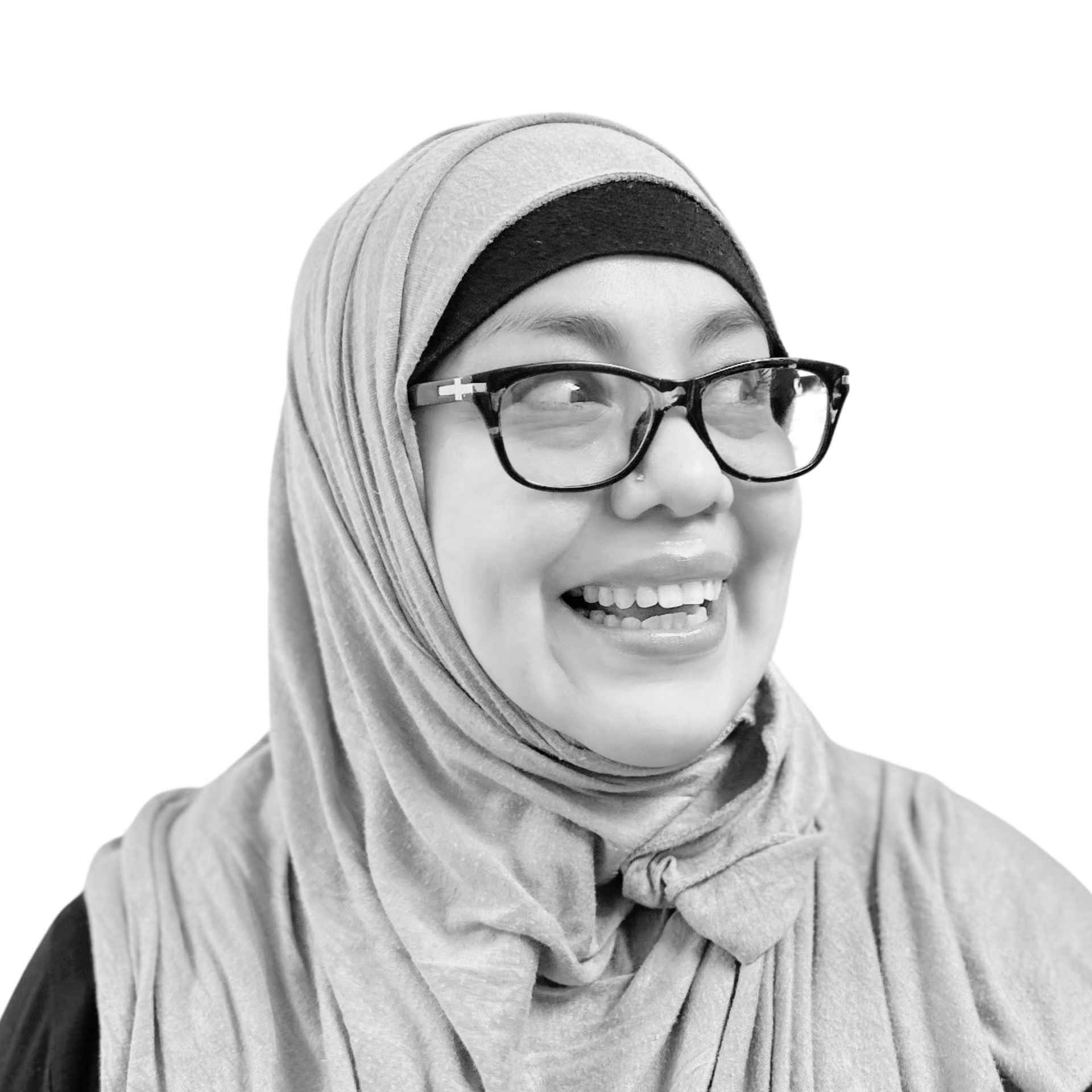 Woman wearing glasses and a headscarf smiles, looking to her right.