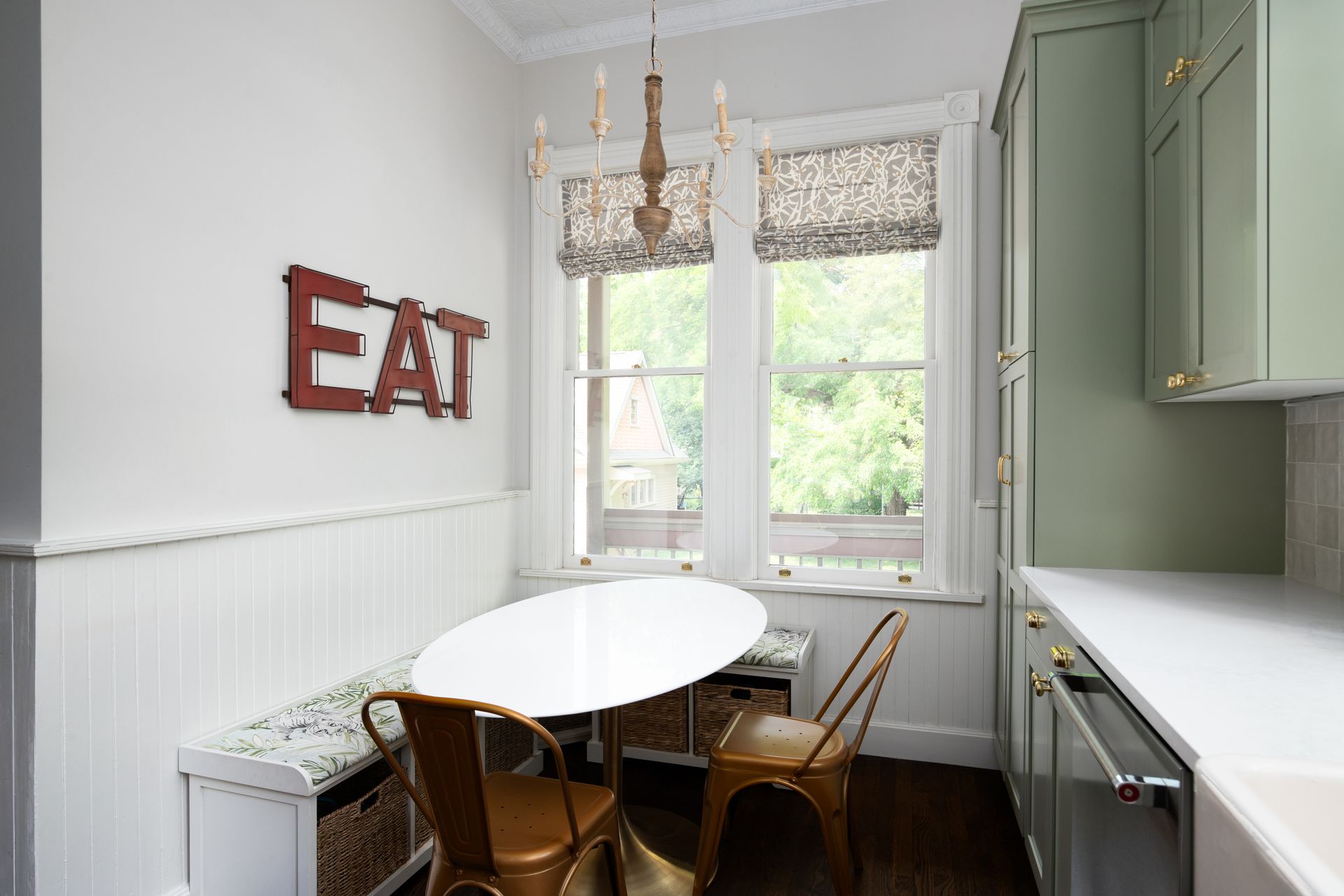 A cozy yet functional breakfast nook with kitchen window treatments in a unique pattern