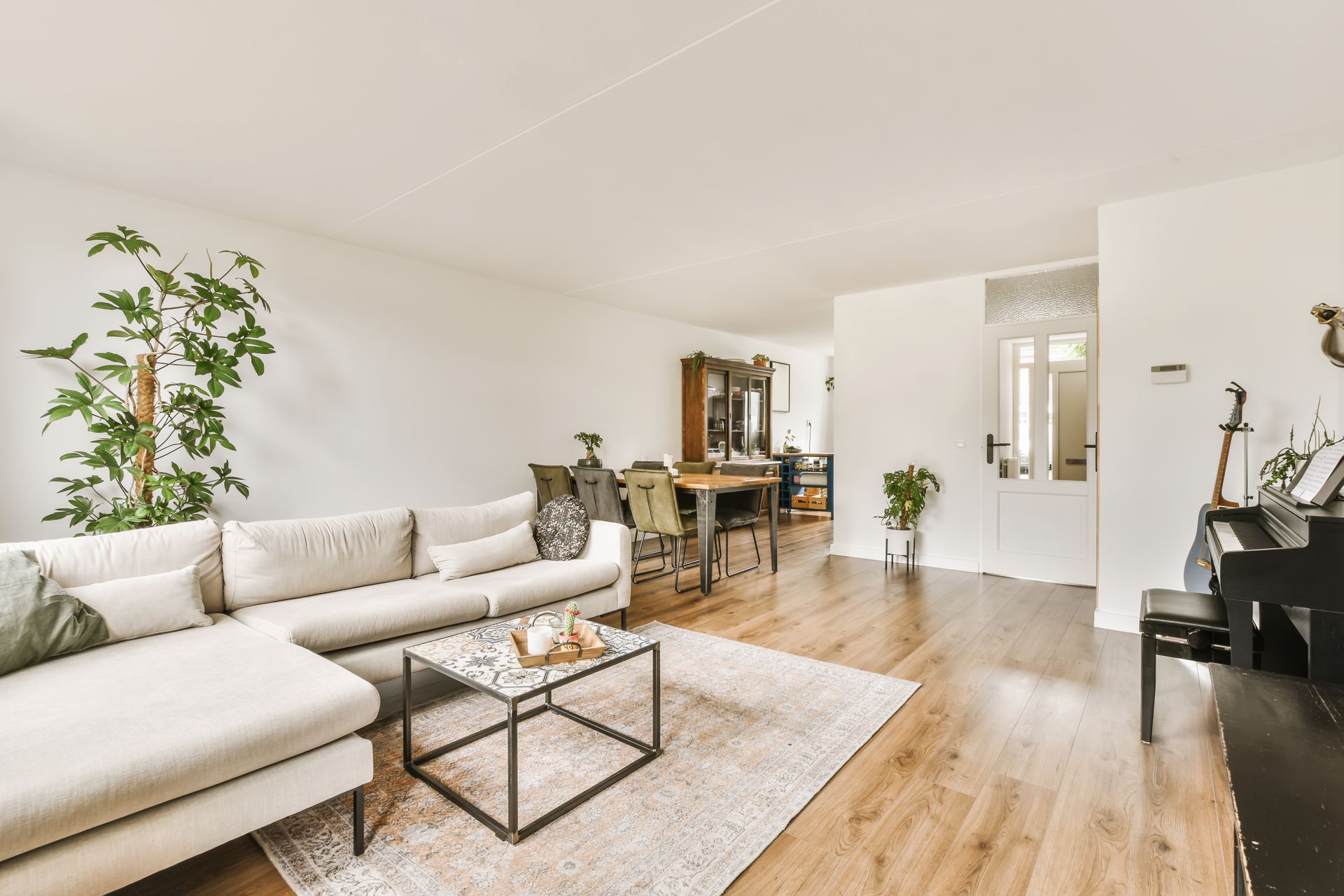 A stylish living room with a custom area rug that anchors the seating area