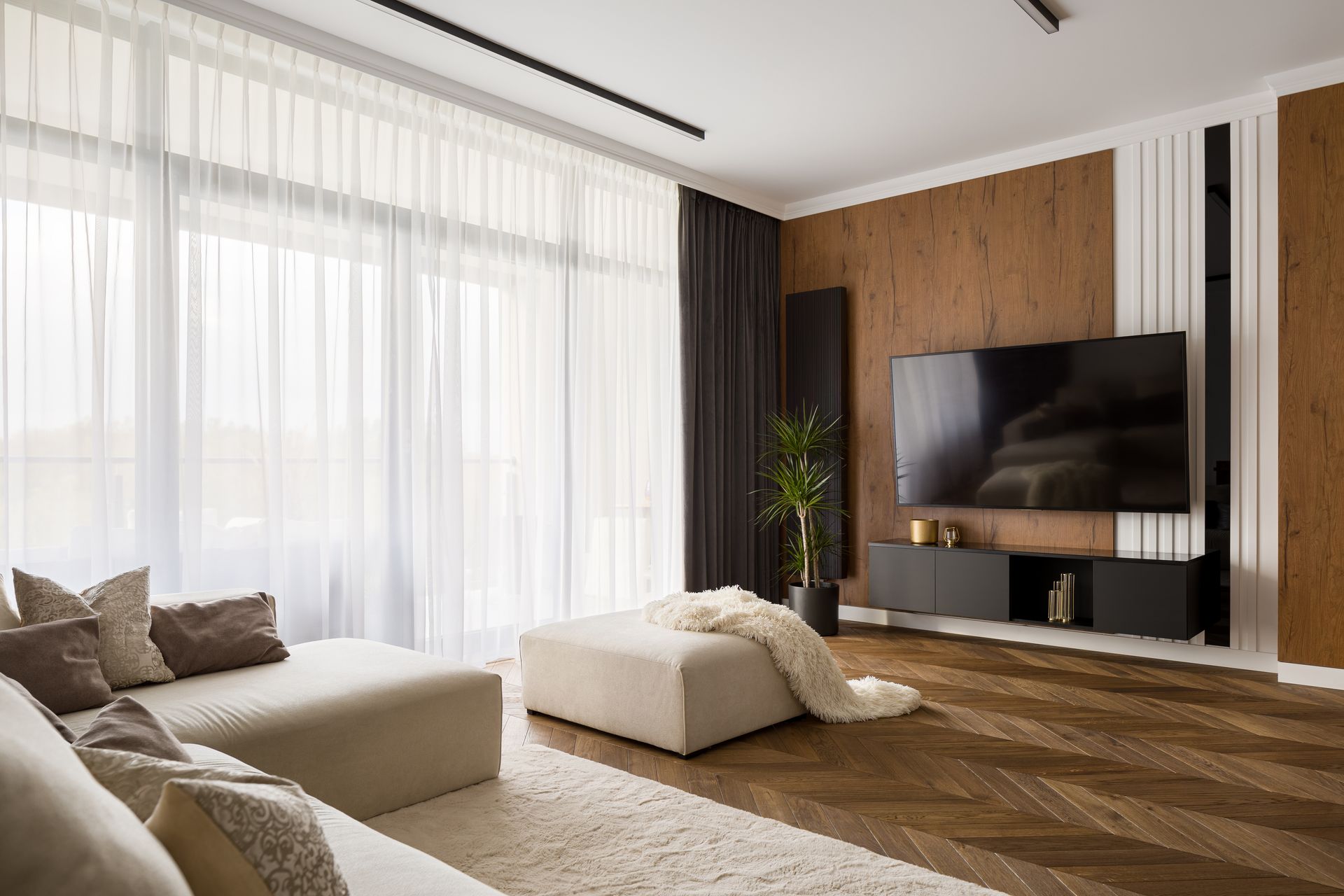 Gorgeous ceiling track drapery on a large sliding door in a chic living room