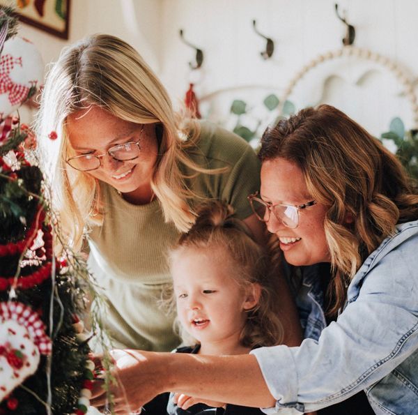 Valerie, her young daughter and her family look fondly at the holiday lights.