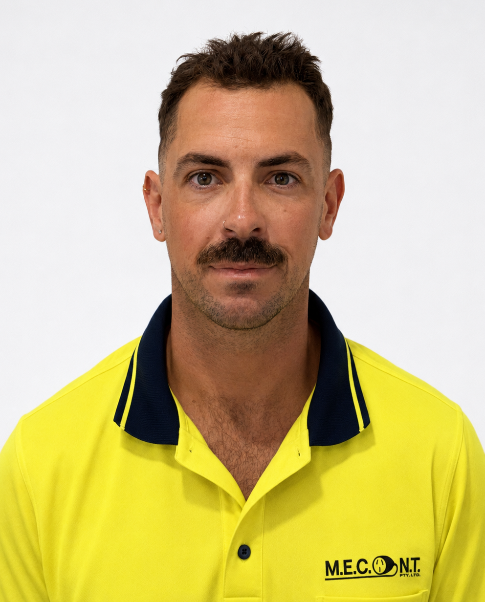 Portrait of a man in a yellow high-visibility shirt against a white background