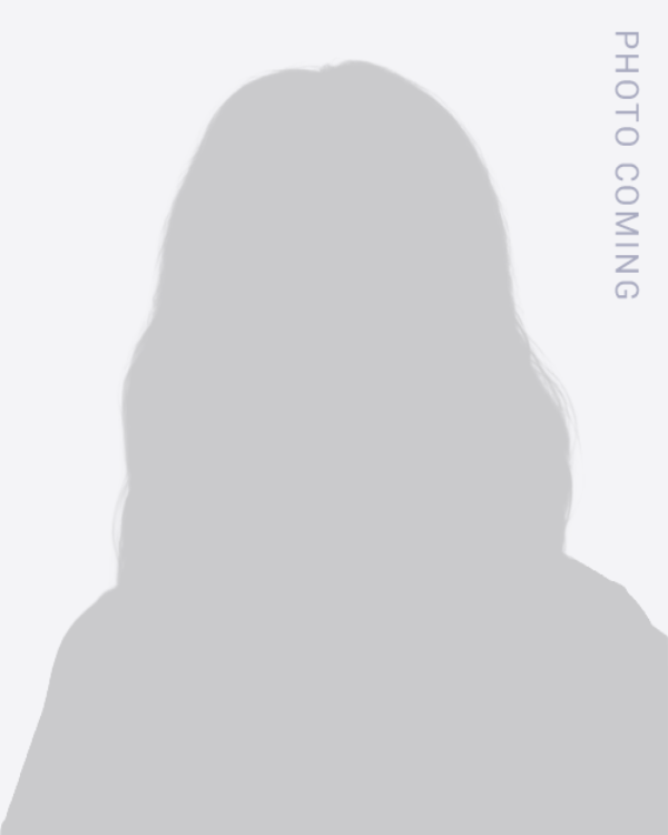 Gray silhouette placeholder portrait with “PHOTO COMING” text on the right