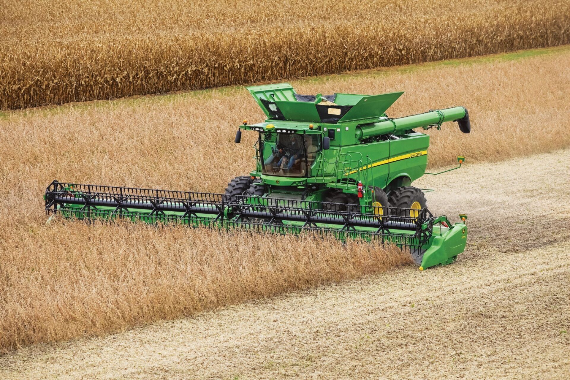 Exterior view of John Deere combine harvesting