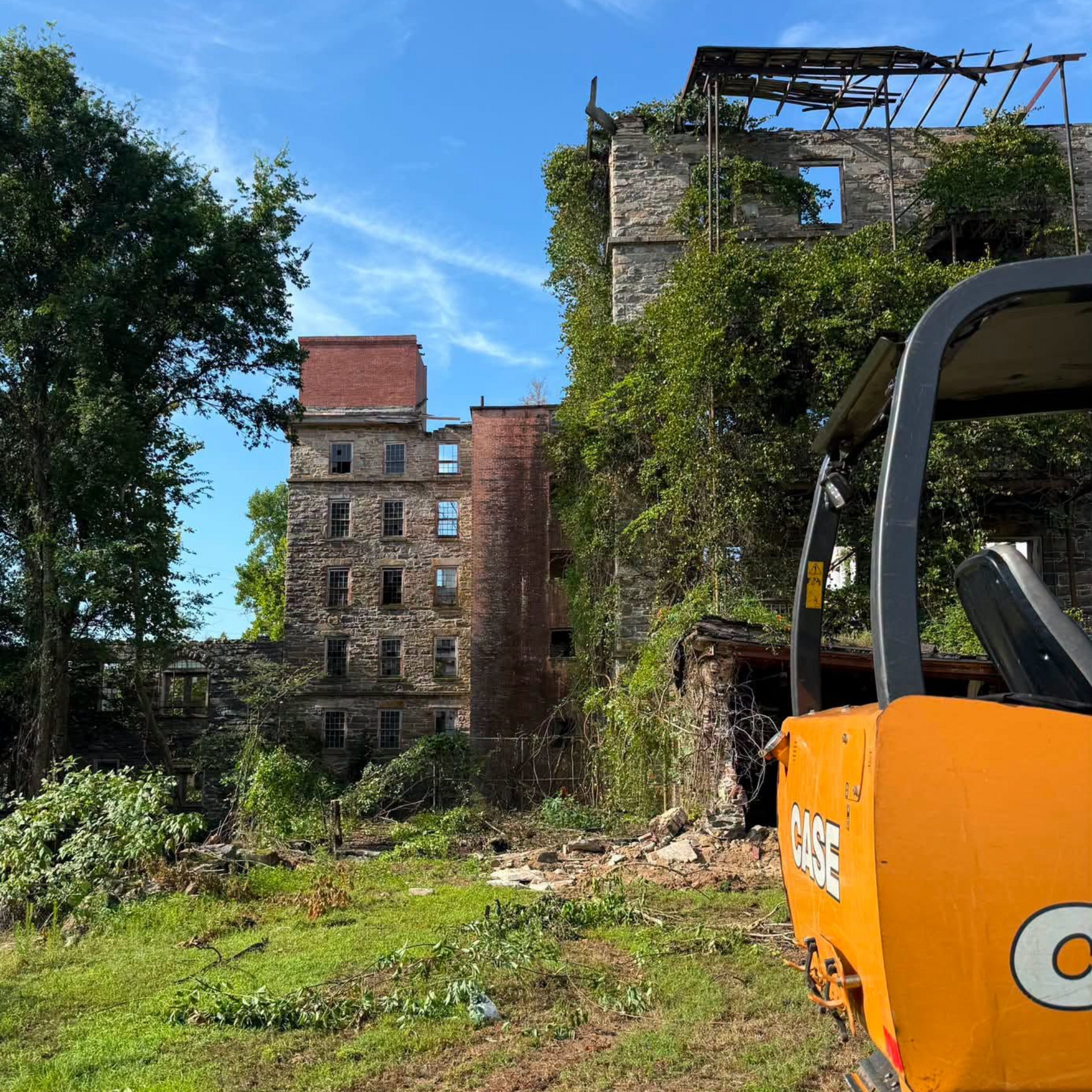 Tree and brush removal underway around Tallassee's historic 1852 Mill as ongoing preservation