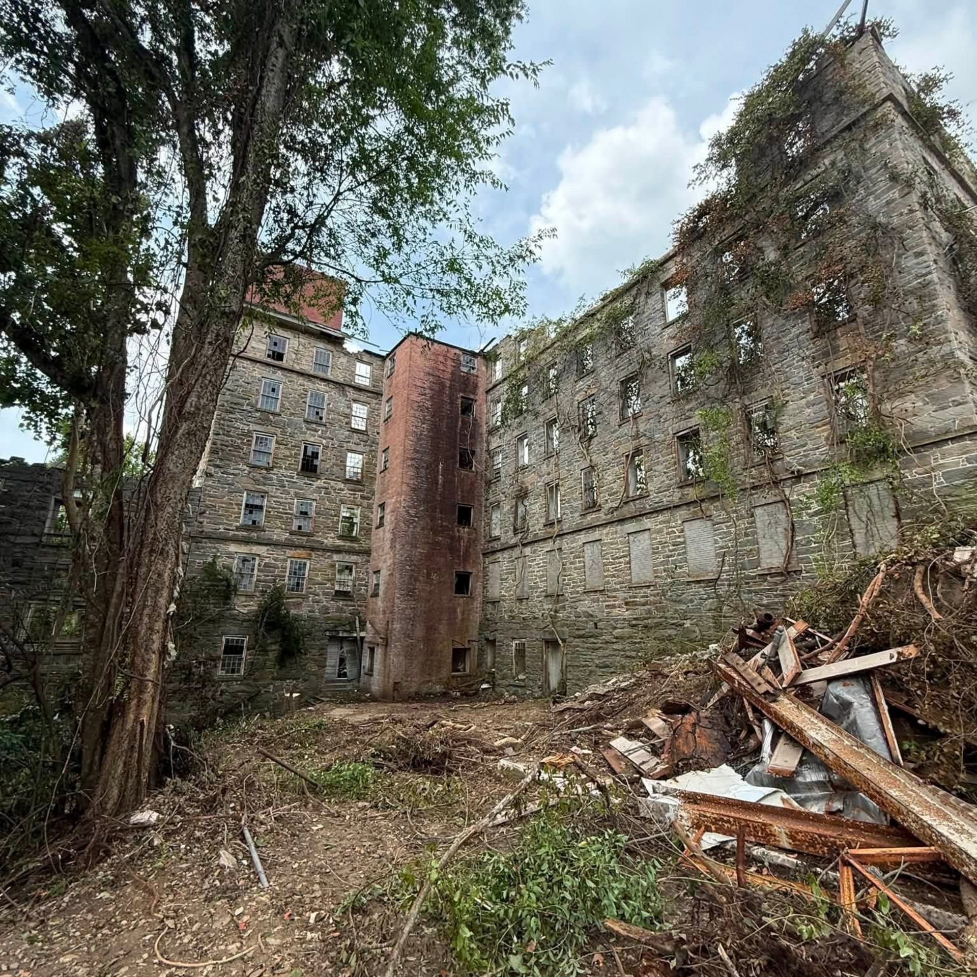 Cleanup and vegetation removal at the historic 1852 Mill in Tallassee, Alabama, preparing the West Side Mill site for future redevelopment.
