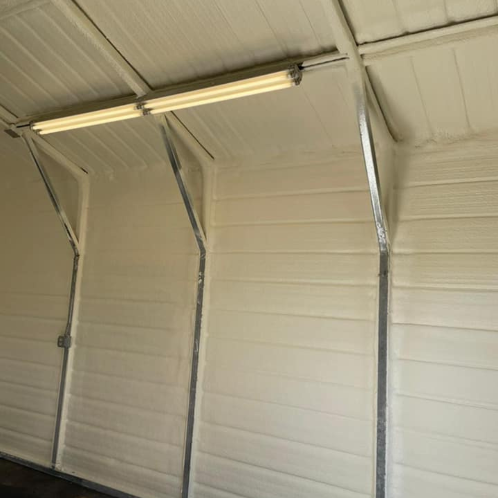 a garage with white walls and a light on the ceiling .