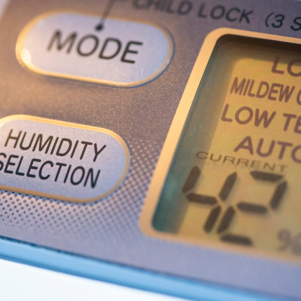 a close up of a humidity selection button on a device