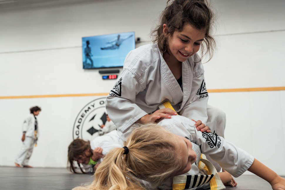 Kids practicing karate drills at Academy of Jiu-Jitsu Scottsdale in Scottsdale, AZ to build focus and confidence.