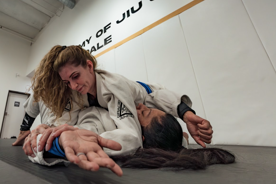 Kids practice controlled Youth Jiu-Jitsu drills at Academy of Jiu-Jitsu Scottsdale in Scottsdale, AZ to build focus.