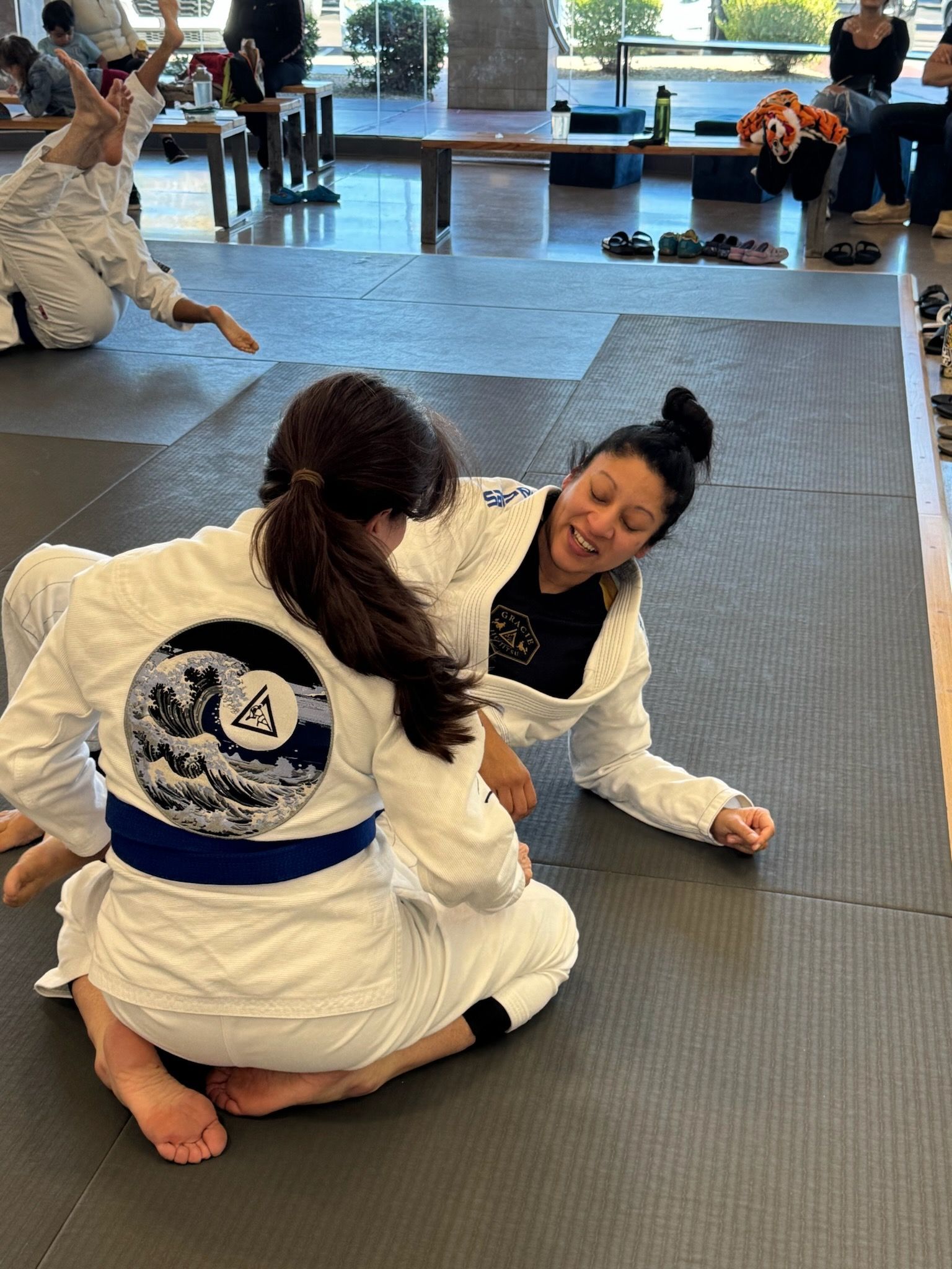 Kids and adults practicing controlled Jiu-Jitsu drills at Academy of Jiu-Jitsu Scottsdale.