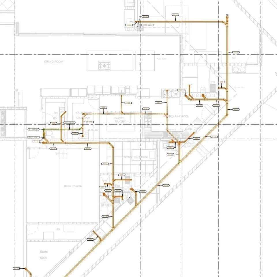 Technical floor plan with orange plumbing or piping lines over a white architectural drawing