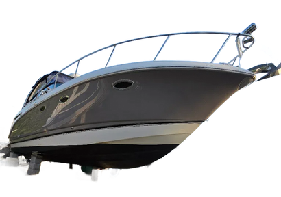 A sleek gray motor yacht with a black hull, seen from a low angle against a white background.