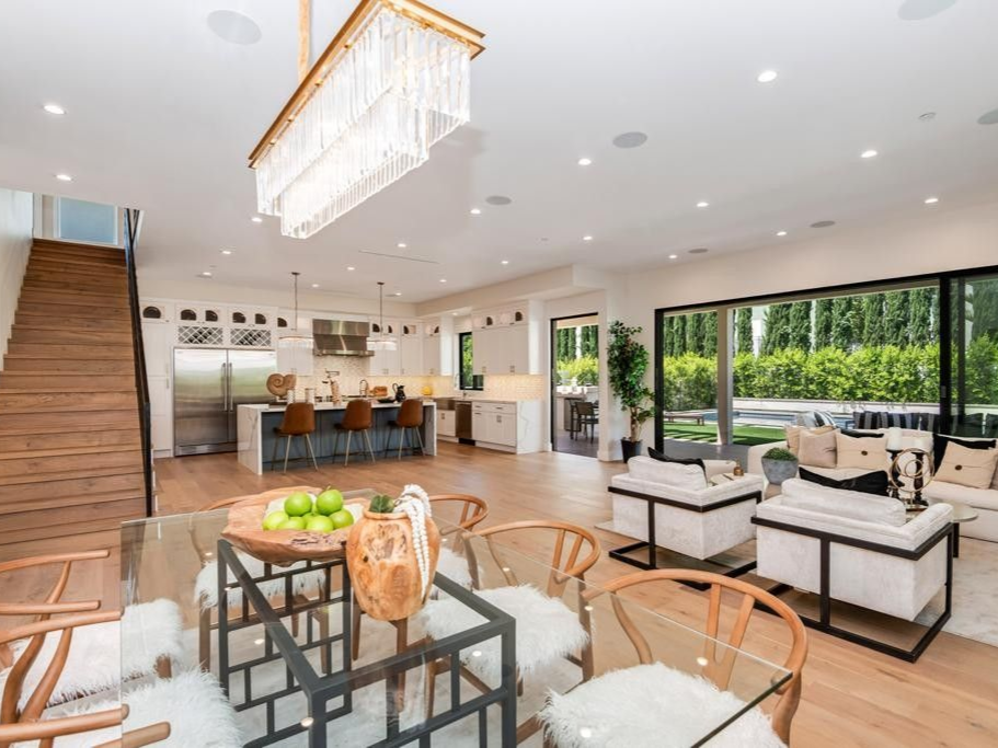 Spacious modern home interior with open kitchen, dining, and living areas.