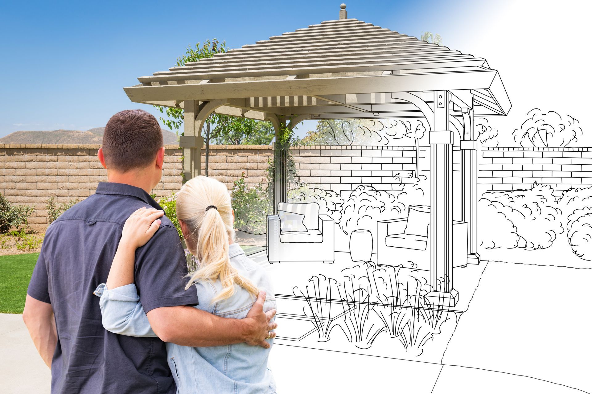 Couple reviewing outdoor patio and pergola remodeling design plans for renovation in Los Angeles.