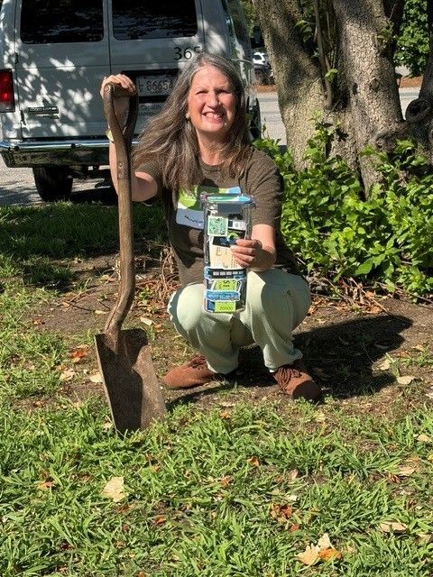Cara Marcus getting ready to bury the Rural Transit Day Time Capsule