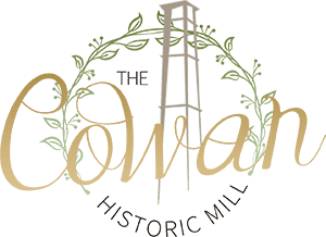 A logo for the colman historic mill with a tower in the middle