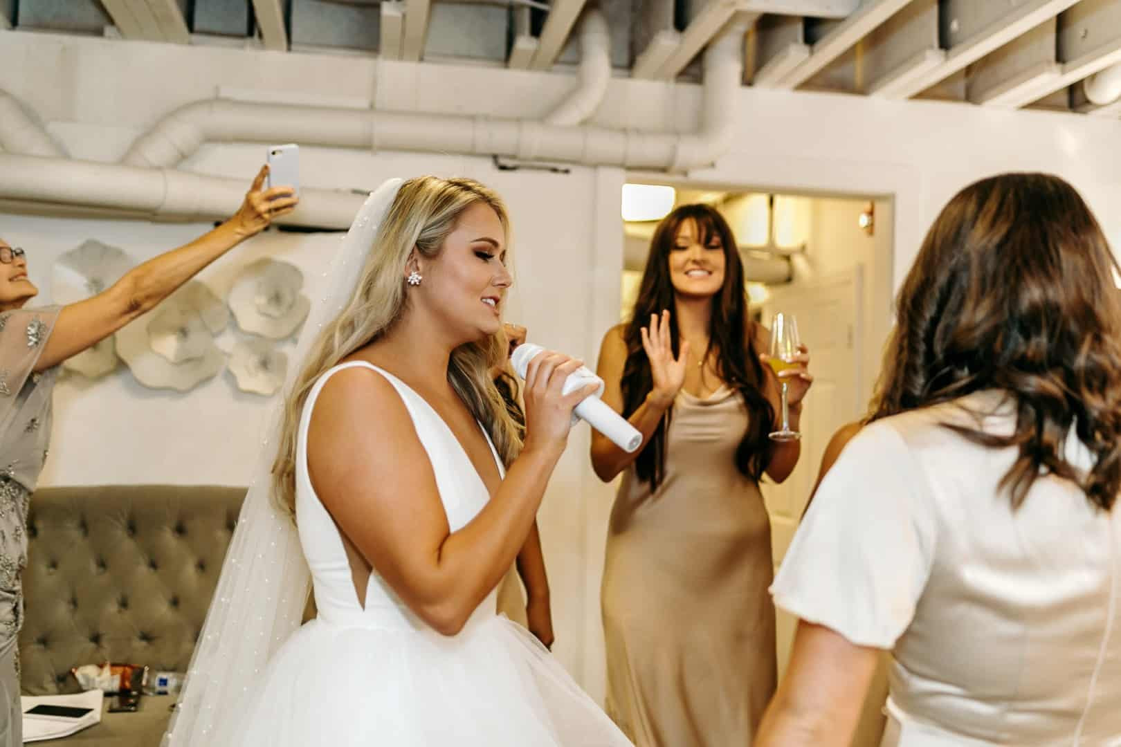 A group of women are standing next to each other in a room.