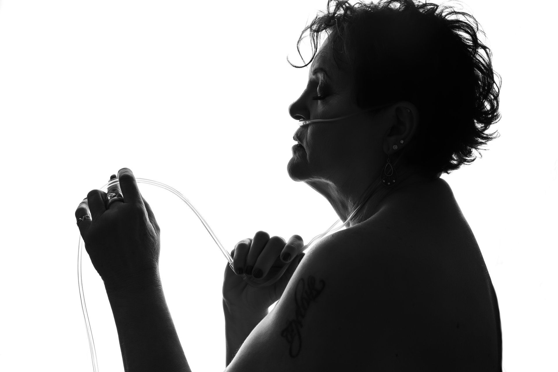 woman with oxygen apparatus during her boudoir session