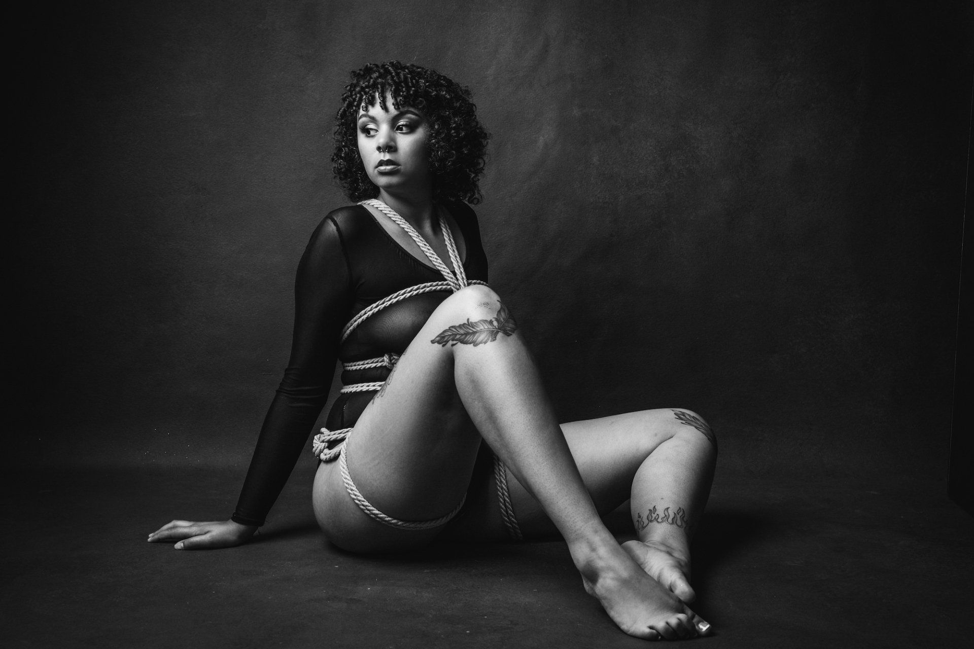 A woman sitting on the floor.