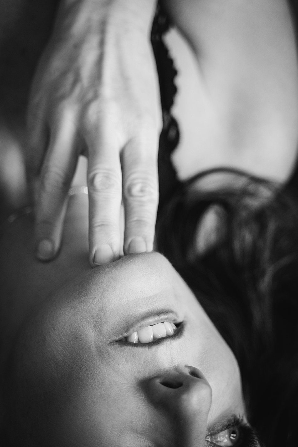 detail shot of woman's face and hand