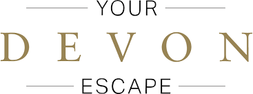 The logo for your devon escape is on a white background.