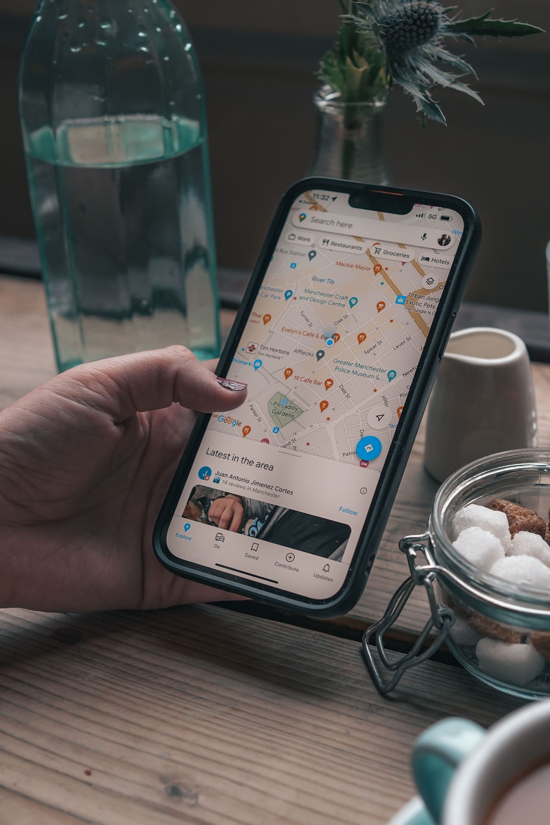 Person searching a map on a smartphone