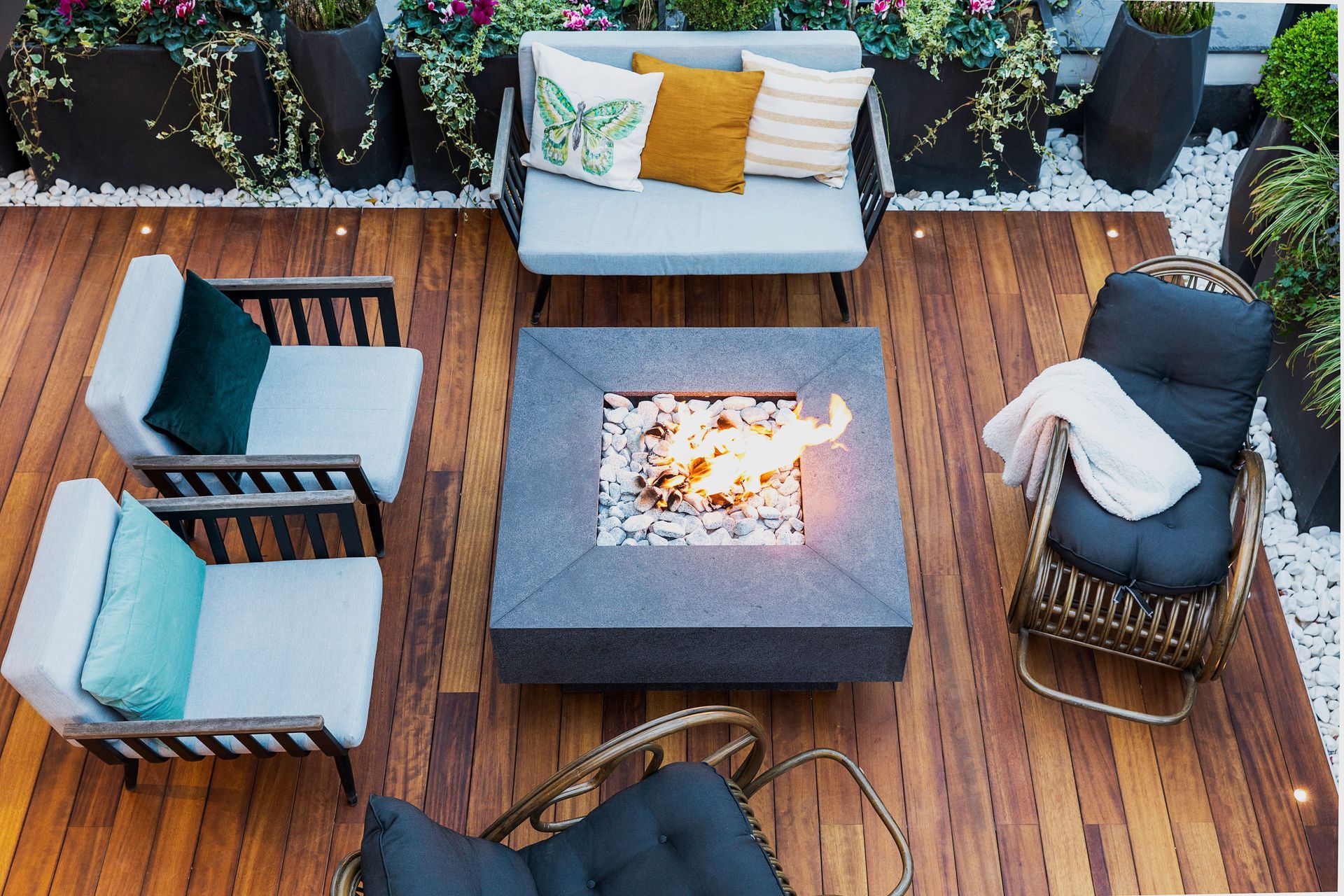 Composite deck with outdoor seating and planting