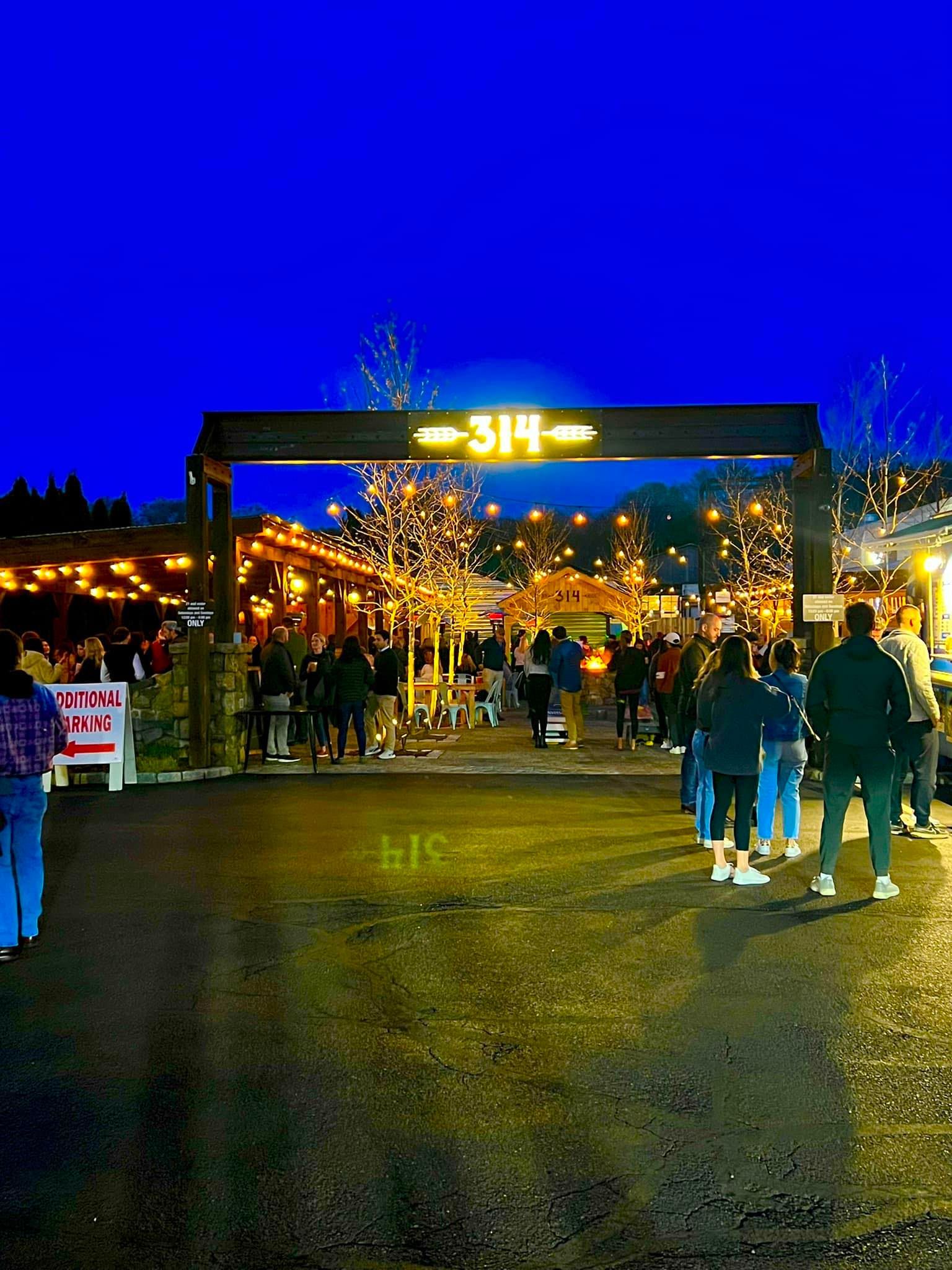 Night scene at a venue entrance, labeled 