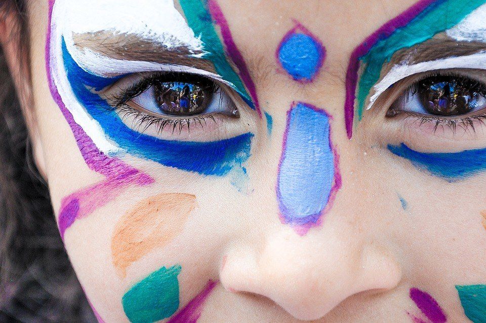 A close up of a person 's face with paint on it