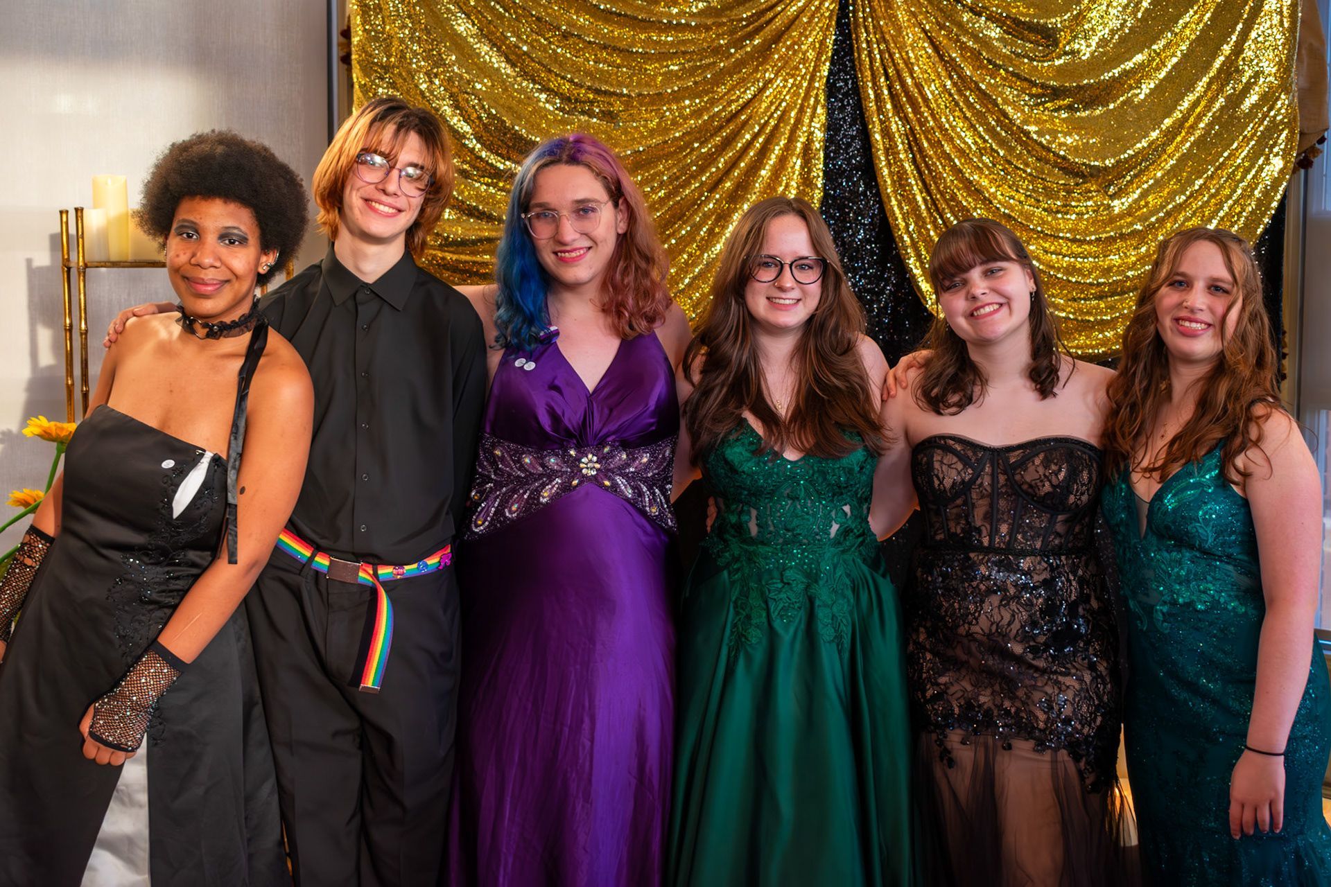 A group of people are posing at the Health Collective's Queer Prom. A group of people are posing at the Health Collective's Queer Prom.