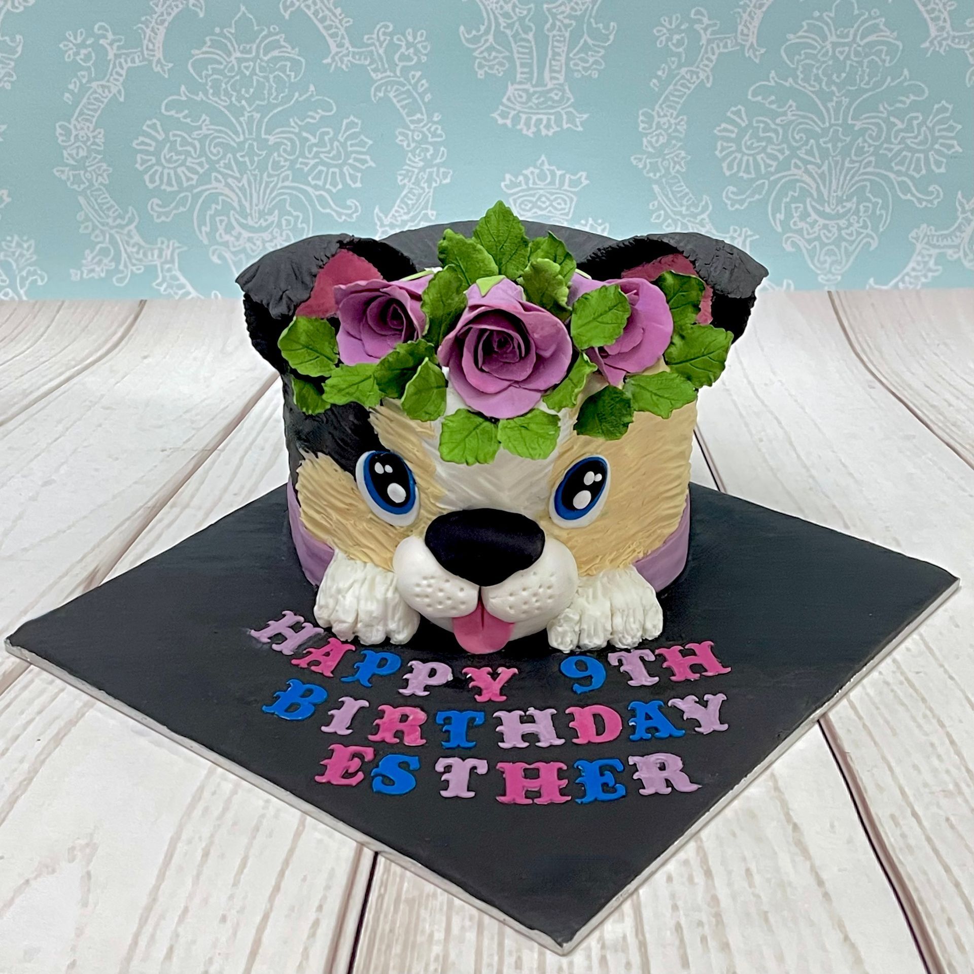 Cute puppy dog cake Port Macquarie, with sugar flower crown.