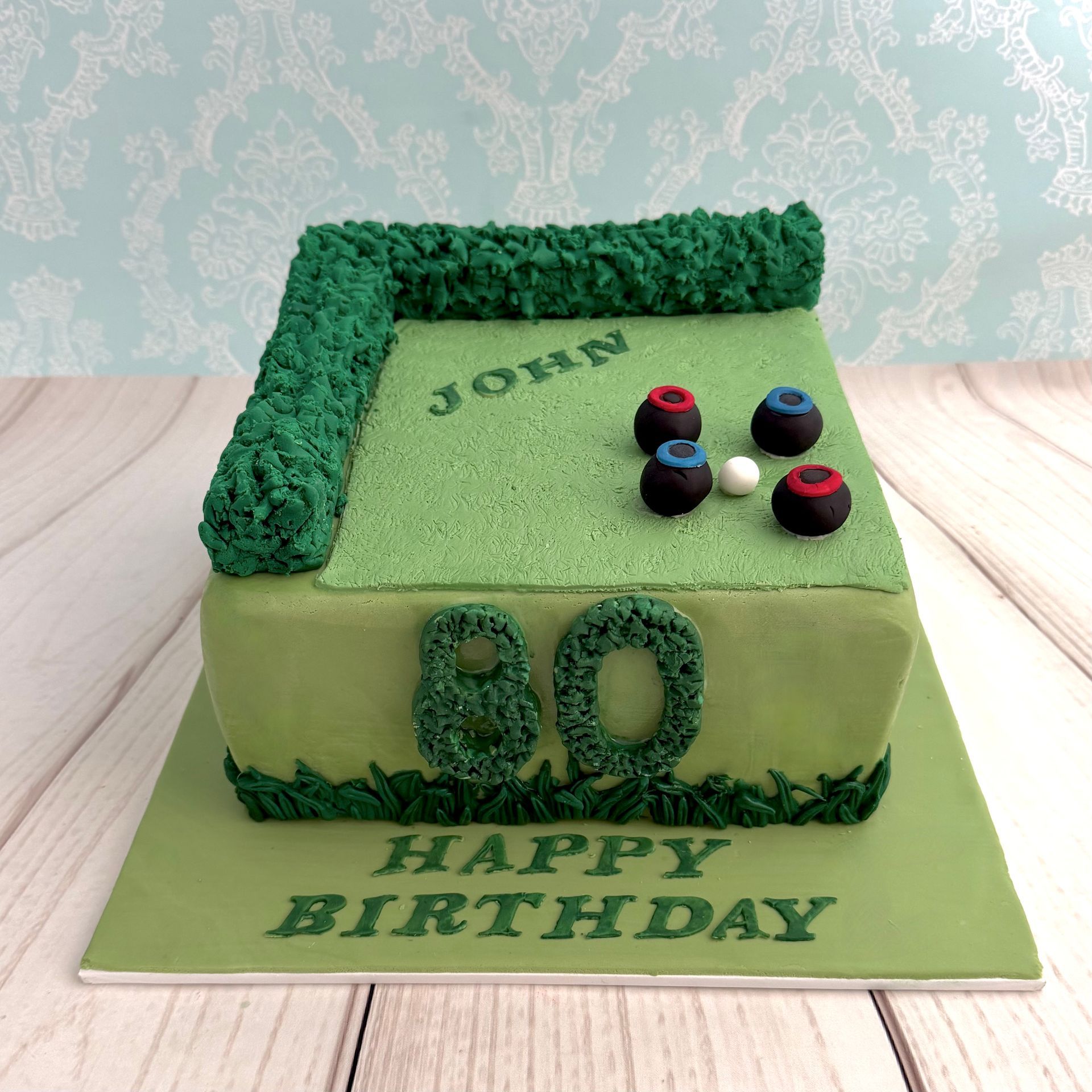 80th Birthday cake, with soft green fondant, Fondant Hedge, Fondant Lawn, Fondant lawn bowling balls.