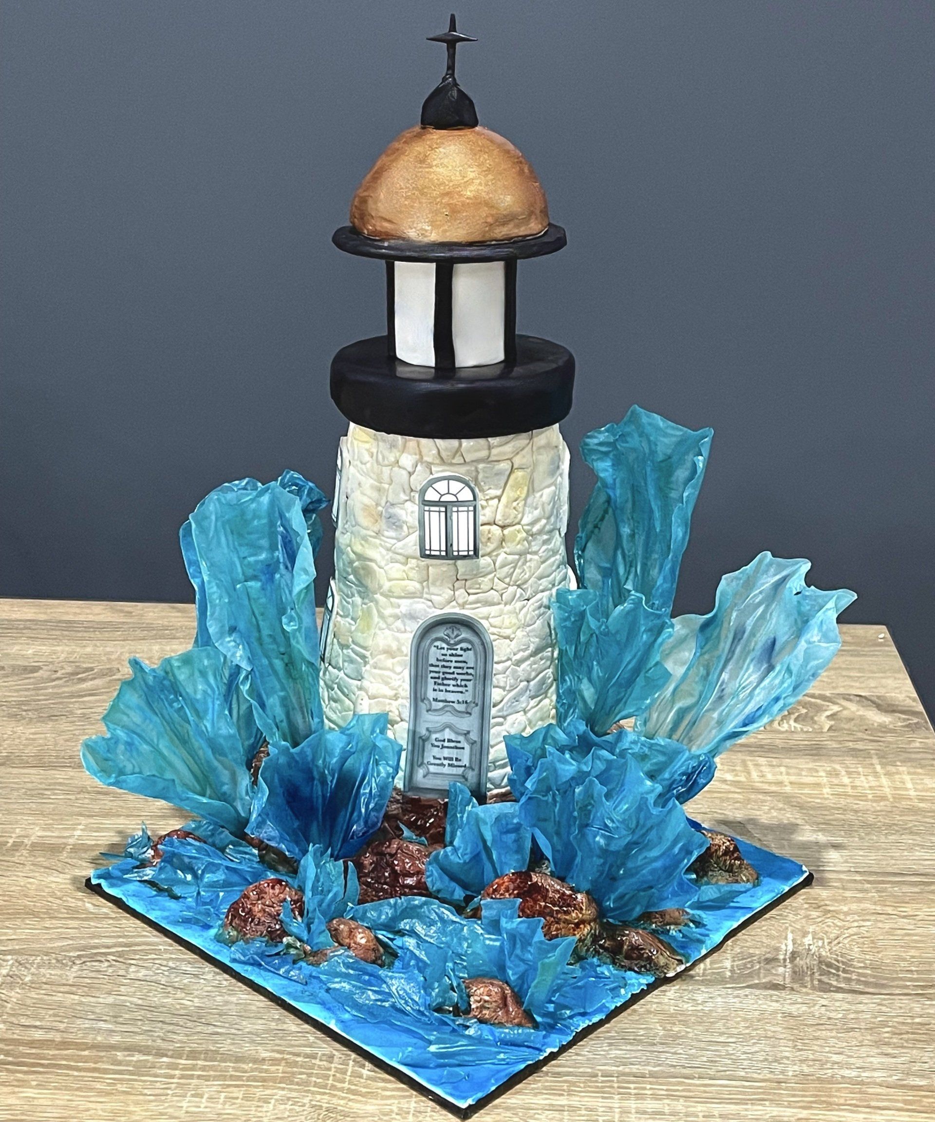 Farewell cake. Made to look like a Lighthouse, with edible rocks and rice paper waves.