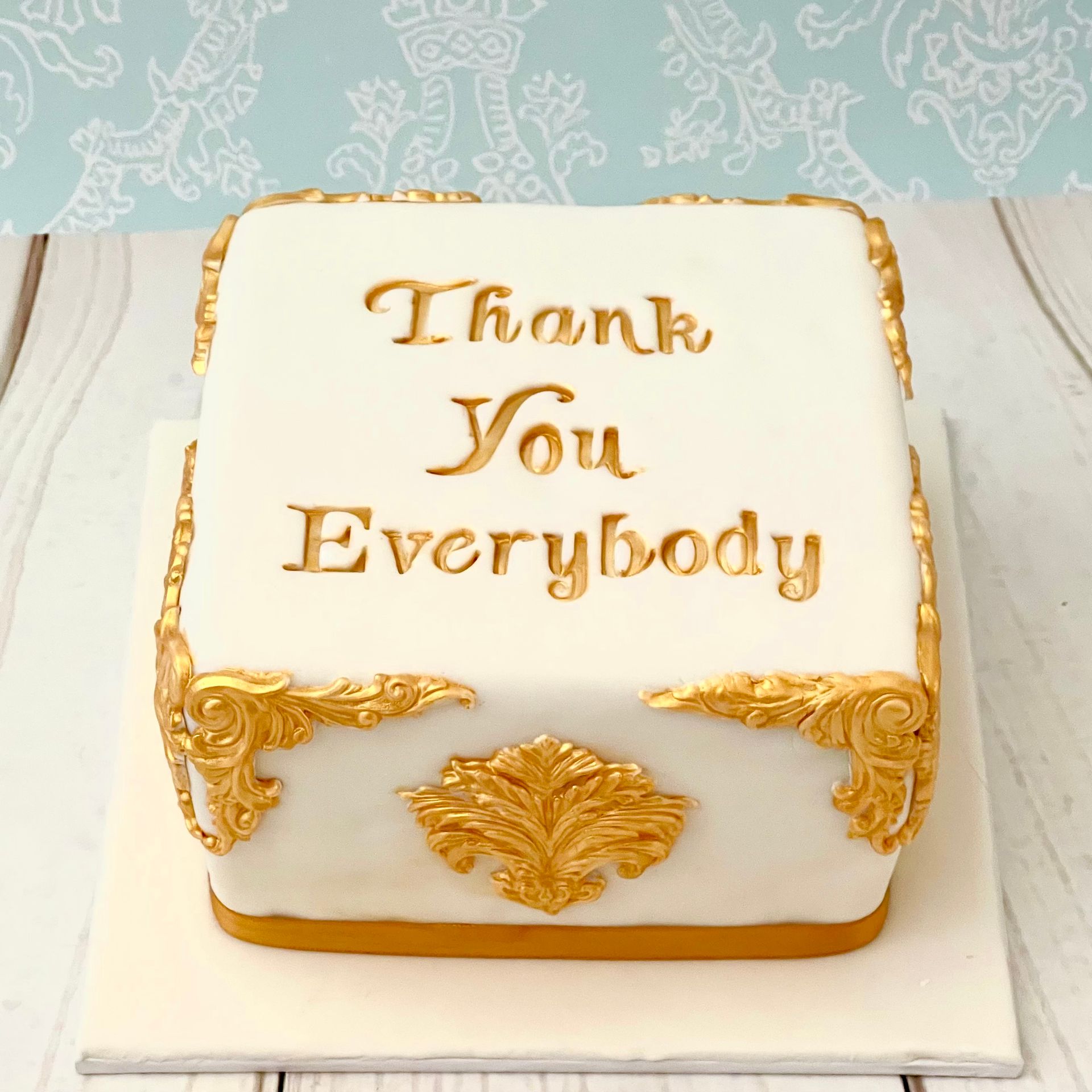 Thank You cake with gold hand painted Thank You and Gold sugar mouldings around the sides