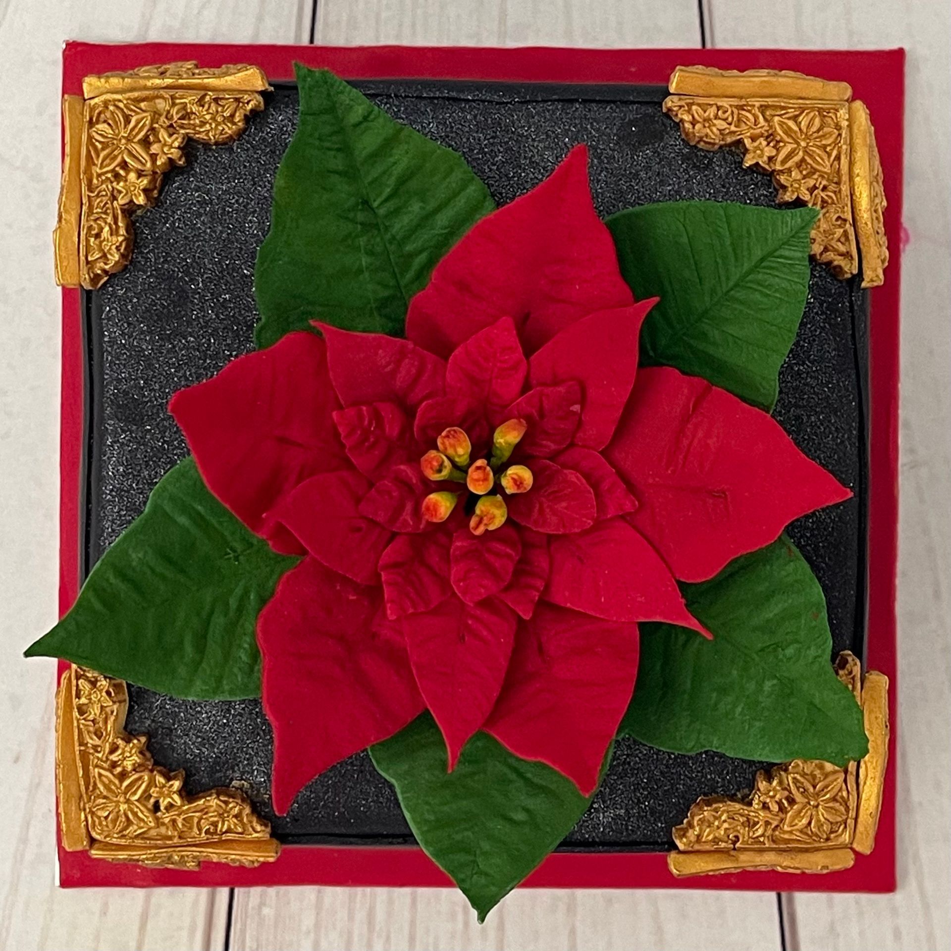 Christmas Cake with handmade sugar poinsettia fancy gold fondant border 