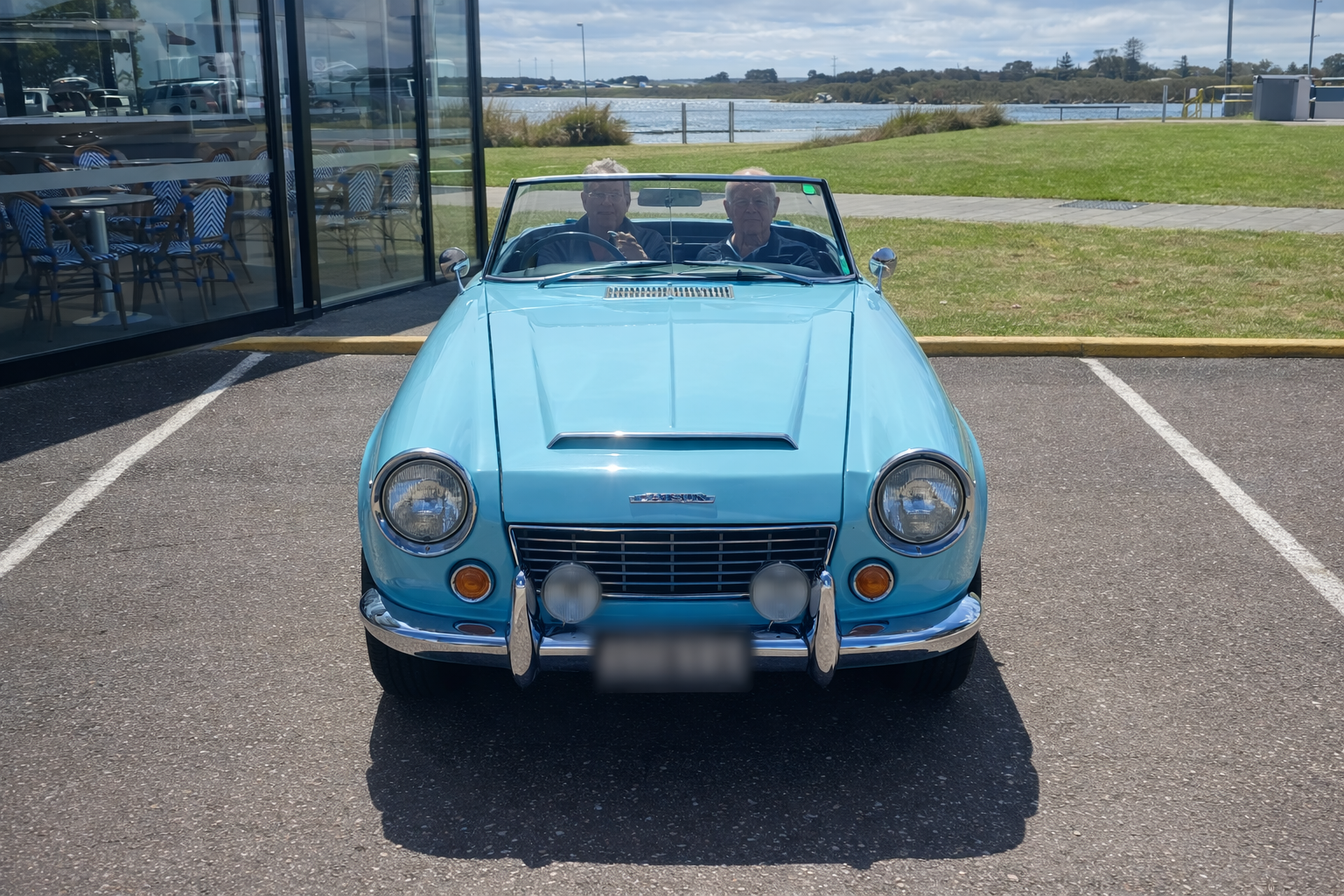 A White Sports Car Is Parked Next To A White Van — All Clean Auto Detailing In Caves Beach, NSW