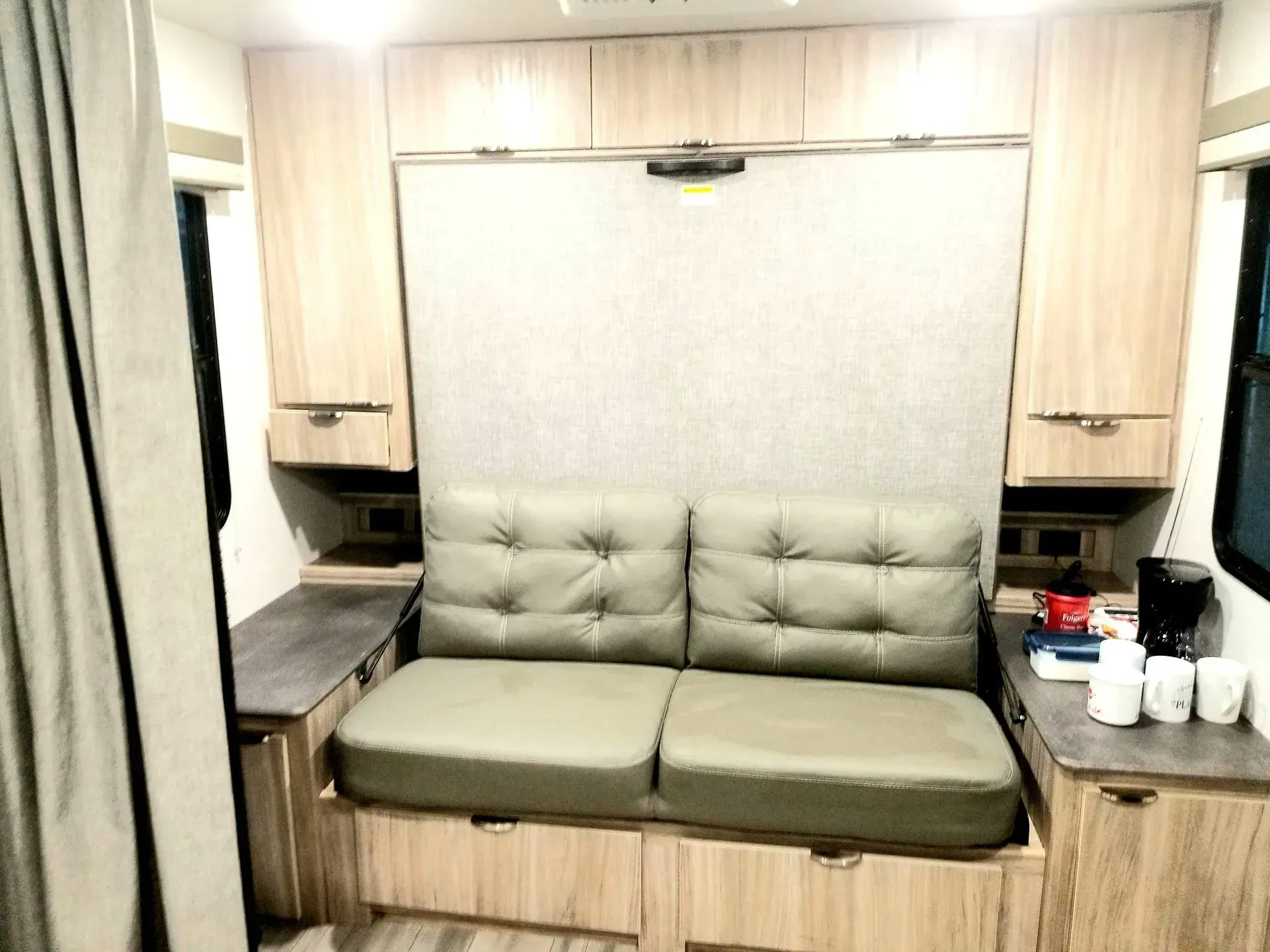 There is a couch in the middle of the room.