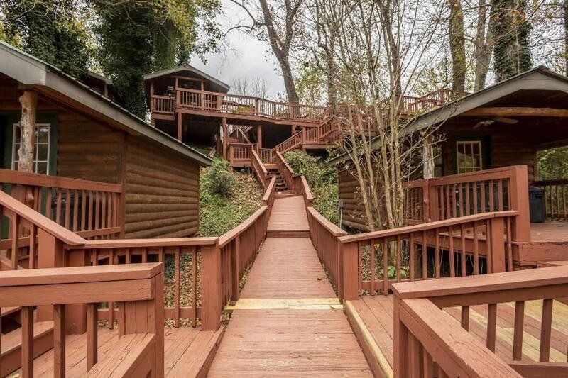 wooden walkway leading to log cabins at copper johns resort