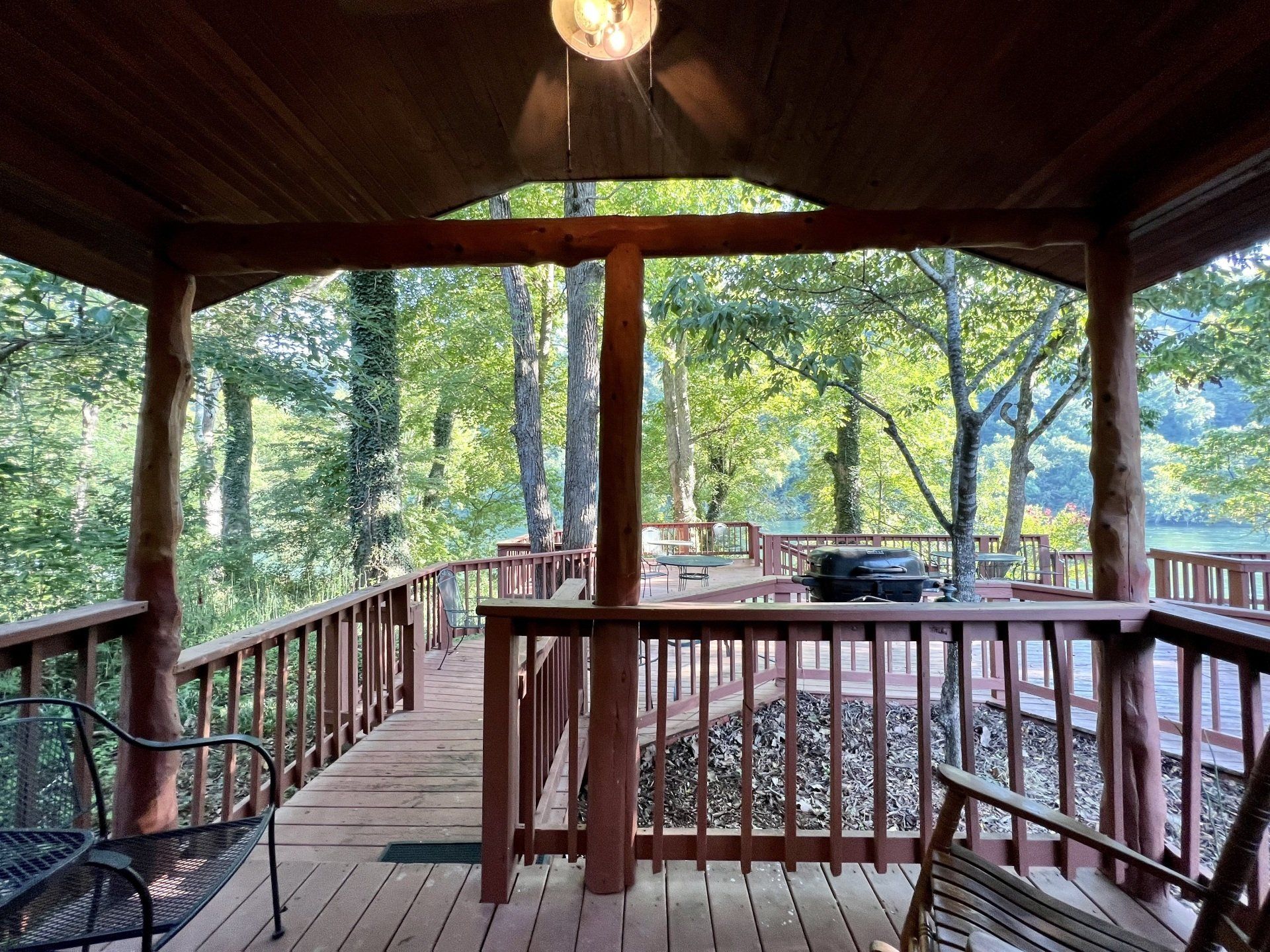 covered porch opening up to wooden walkway on white river at copper johns resort
